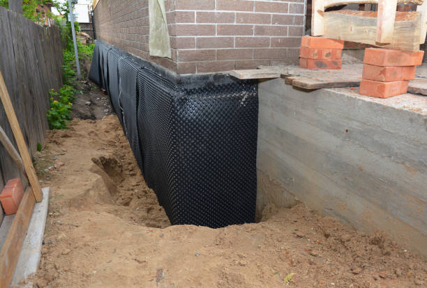 Happy homeowners after waterproofing job in Fountaintown